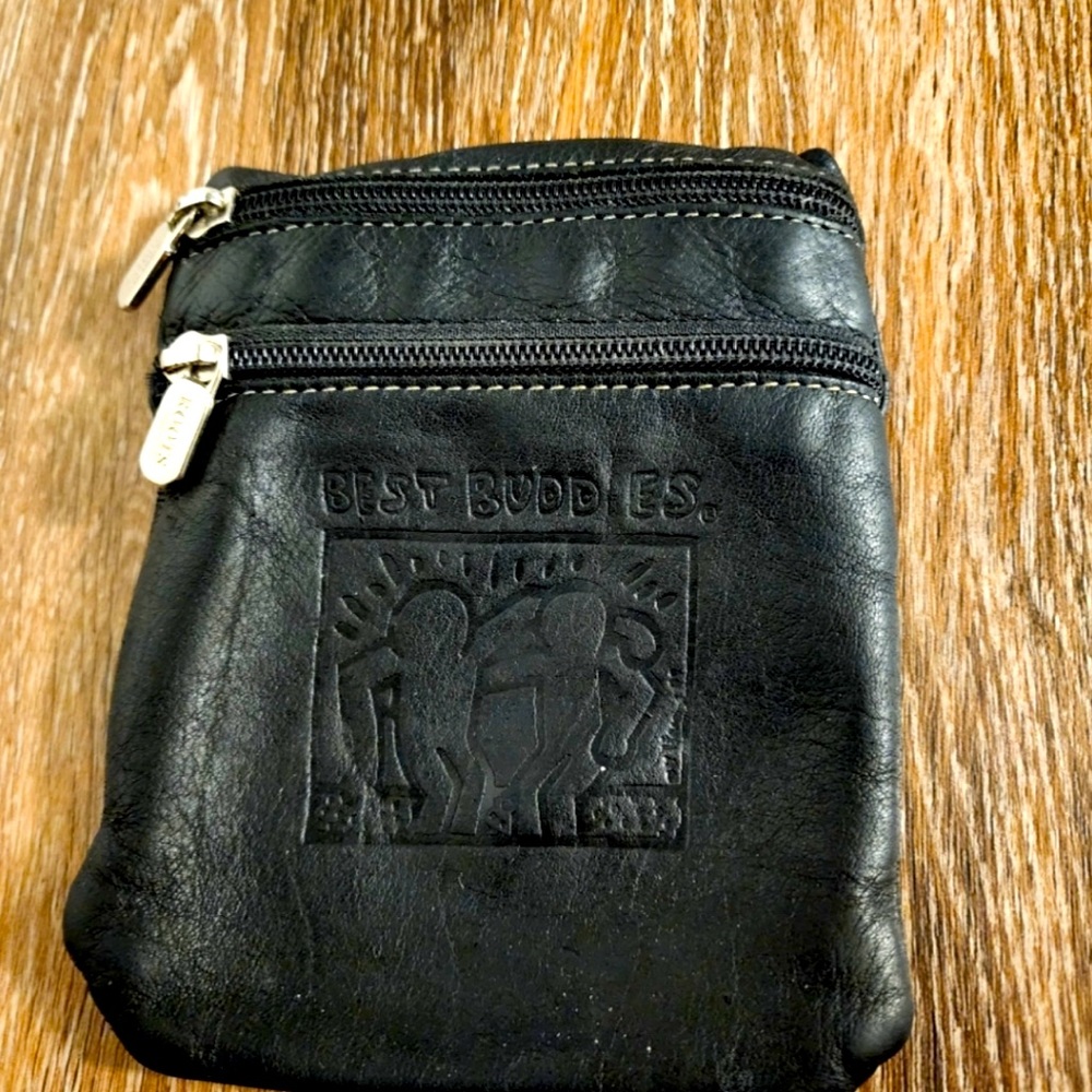 ROOTS leather, “Best Buddies” pouch bag with two zippered pockets.